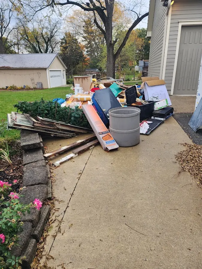 Dumpster being loaded with debris for Residential Dumpster Rental in Spring Valley